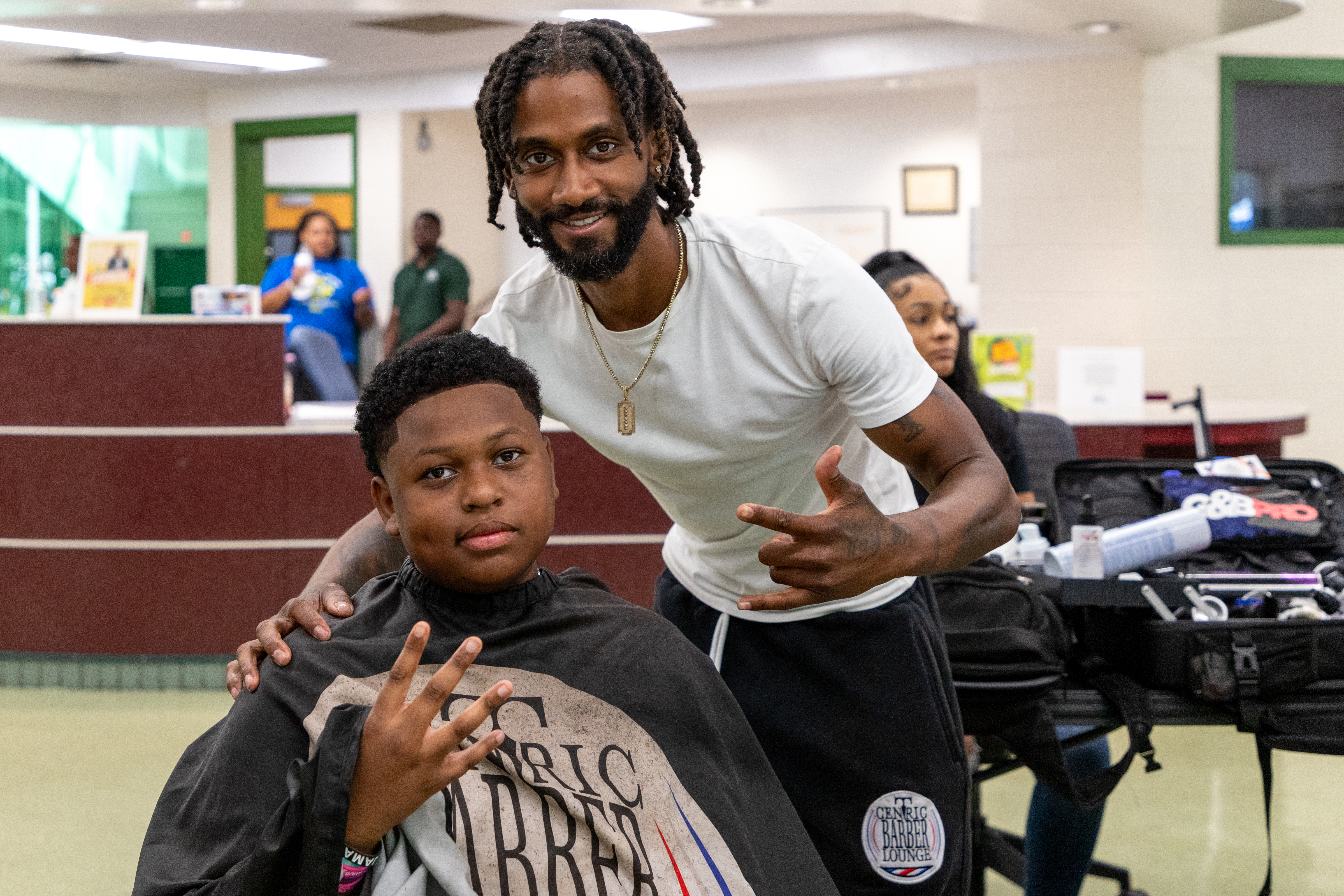 Barber after cutting a kid's hair
